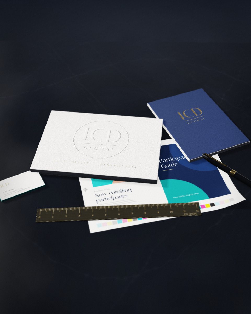 Fine printed materials arranged on dark marble